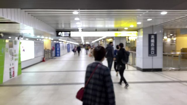 Taipei, Taiwan-15 March, 2020: 4K, Blurred defocused view of Taiwaneses travellers wear mask at metro main station to prevent infection from coronavirus. The Covid-19 caused emergency situation-Dan