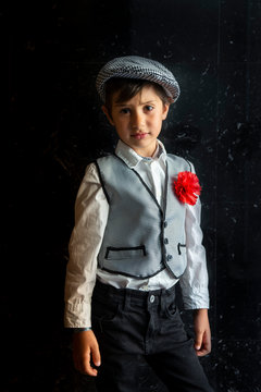 boy with a chulapo cap in san isidro madrid