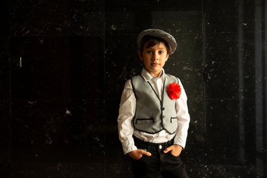 boy with a chulapo cap in san isidro madrid