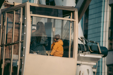 People in the cab in the ferris wheel