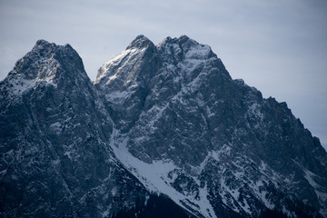 High alpine mountains with snow in Germany and blue beautiful sky