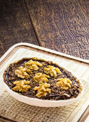 Chocolate egg with filling for Easter on wooden background. Selective focus, wooden background. Easter 2020.