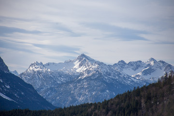High alpine mountains with snow in Germany and blue beautiful sky