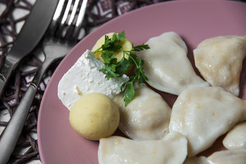 dumplings with potatoes, homemade traditional Ukrainian dish varenyky