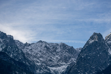 High alpine mountains with snow in Germany and blue beautiful sky