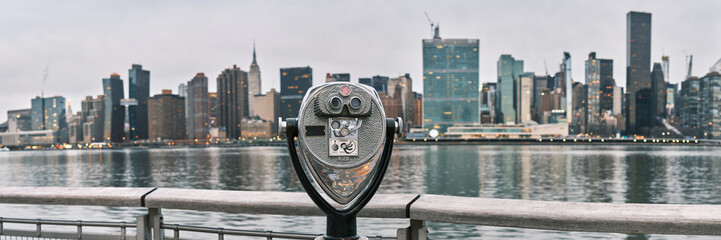 Panorama of tourist binoculars with Manhattan, New York City skyline in the background