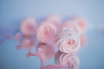 Homemade pink marshmallows on pastel pink background. Creative concept Marshmallow, Meringue....