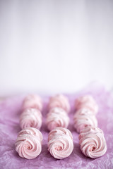 Homemade pink marshmallows on pastel pink background. Creative concept Marshmallow, Meringue. Homemade Sweets dessert