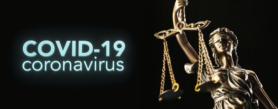 coronavirus covid-19 and Statue of Justice - law concept