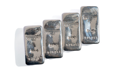 Four ingot of silver produced in Germany, isolated on white background. feinsilber is fine silver.
