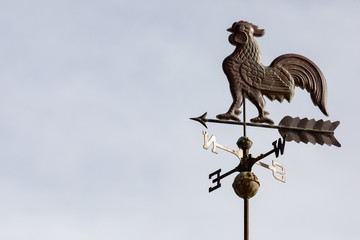 Weather vain with rooster and north, south, east, west directions