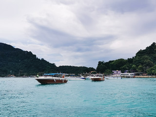 Boats on the beach of Phi Phi island Thailand