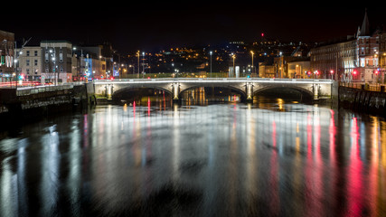 Fototapeta na wymiar Beautiful night view scene Cork city center old town Ireland cityscape reflection river Lee