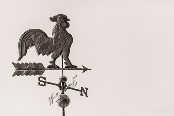 Weather vain with rooster and north, south, east, west directions