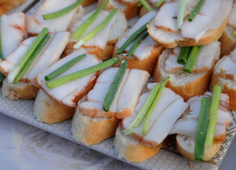 Sandwiches with bacon on a table in Kiev, February 22, 2020