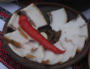 Plate with bacon and pepper on a table in Kiev, February 22, 2020