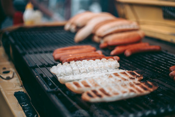 Delicious fresh hot dogs on the grill