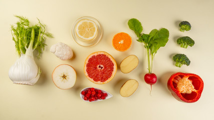 Healthy diet foods, rich in Vitamin C, antioxidants on yellow