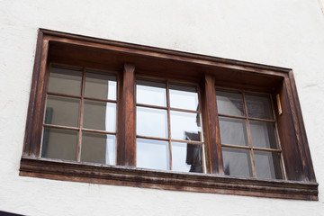 Old vintage wooden window in western european style
