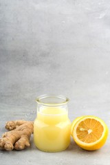 Health and diet content. Natural immune system support kit-ginger and lemon drink. Light gray background.