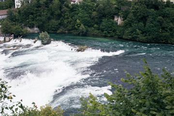 View of a waterfall in the old European city of Schaffhausen