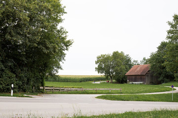 Old wooden house near the field in europe