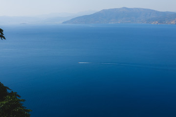 Seaview from the casstle of Naphplion. Ferry sails while sea. Greece.