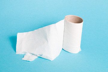 toilet paper is over, sleeve from a roll of white paper, blue background copy space, 2019-2020
