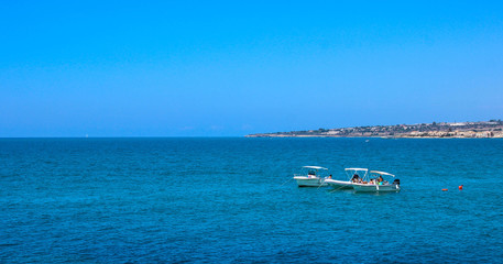 Sailing. Ship yachts with sails in the open blue azure Mediterranean Sea. Blue sky. Free copy space. Relax
