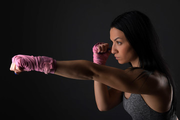 Woman boxer training hard.
