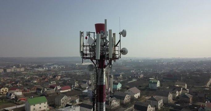 Telecommunication tower of 4G and 5G cellular. Base Station or Base Transceiver Station. Wireless Communication Antenna Transmitter. Telecommunication tower with antennas against blue sky.