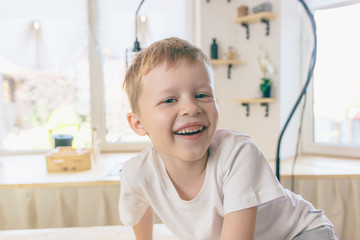 A happy kid has fun at home.
