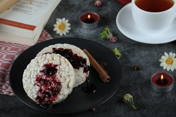 Dietary crackers with red jam and cinnamon
