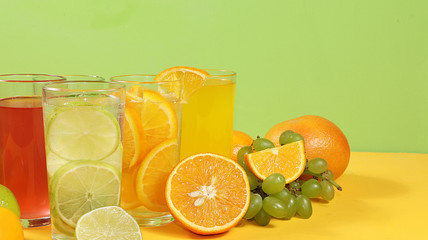 Citrus cider, juice, drink and ingredients on a color table. The concept of detox diet and weight loss, natural nutrition, increasing the body's immunity against viruses and colds