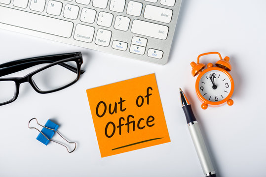 Out of office - memo on office workplace. Holiday Announcement, Day Off or Quarantine Covid-19