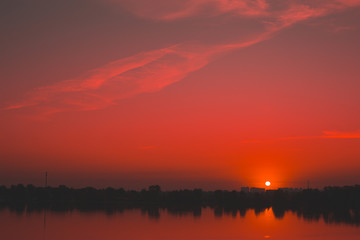 Red saturated sunset on the river