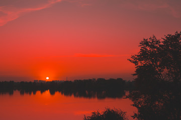 Red saturated sunset on the river