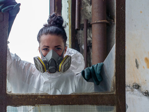 Desperate An Tired Woman With Mask In Abandoned Place