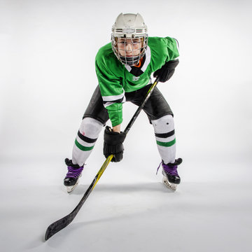 Male youth hockey player skating on the ice