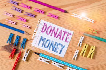 Writing note showing Donate Money. Business concept for to give money or goods to help a...