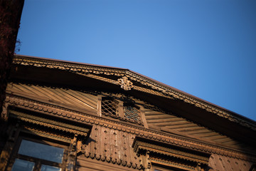 Old wooden house with beautiful platbands
