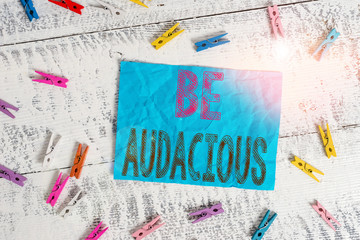 Writing note showing Be Audacious. Business concept for Takes risks in order to achieve something...
