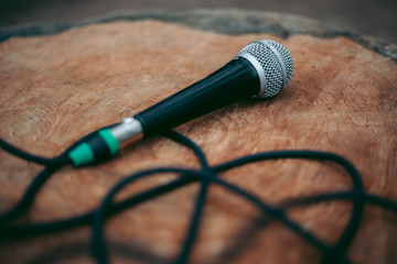 Wired microphone for vocals on a wooden table