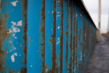 Old blue metal rusty fence