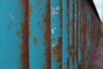 Old blue metal rusty fence