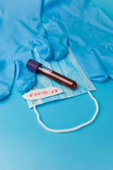 protective mask and gloves on a yellow background