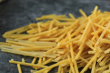 Homemade fresh spaghetti in the left side of the background