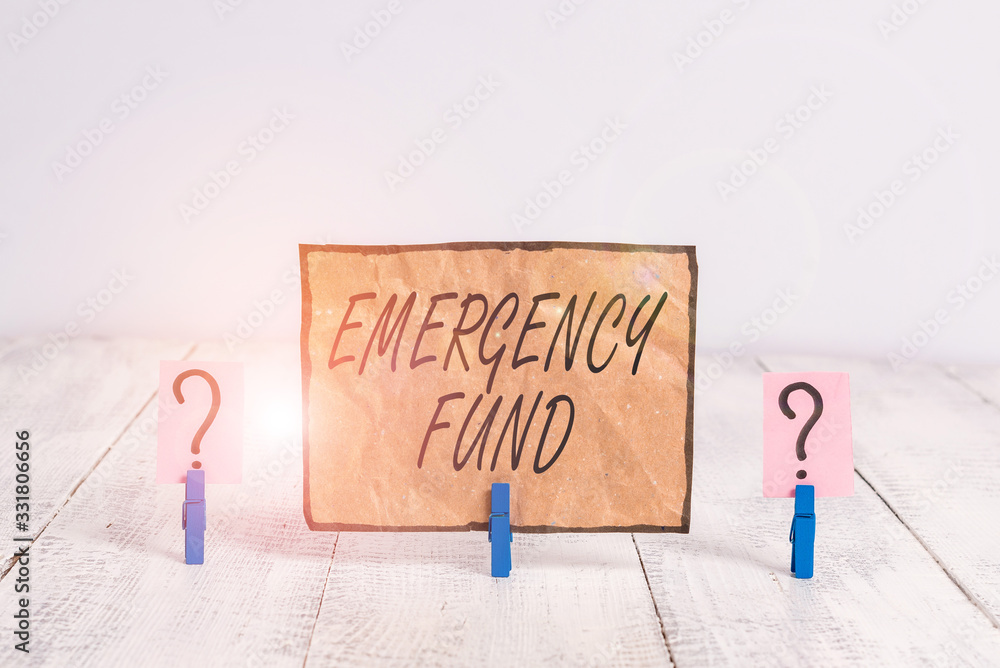 Aufkleber writing note showing emergency fund. business concept for money which is set aside for an emergency 
