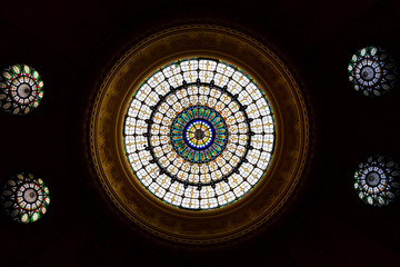 Stained glass window on the ceiling in an old building