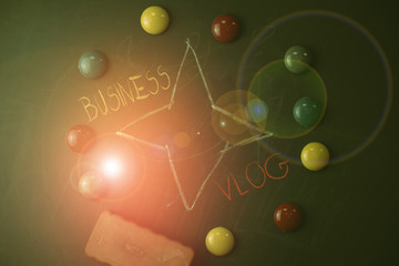 Handwriting text Business Vlog. Conceptual photo A video content about subject matter related to the company Round Flat shape stones with one eraser stick to old chalk black board
